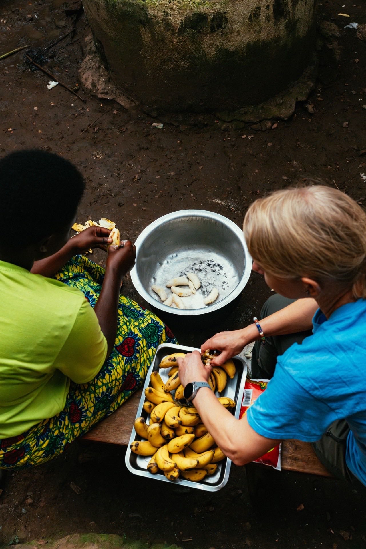 Community cooking together at HopeKitchen Buhoma, Uganda